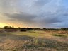 Golfbaan de Stippelberg bij zonsondergang