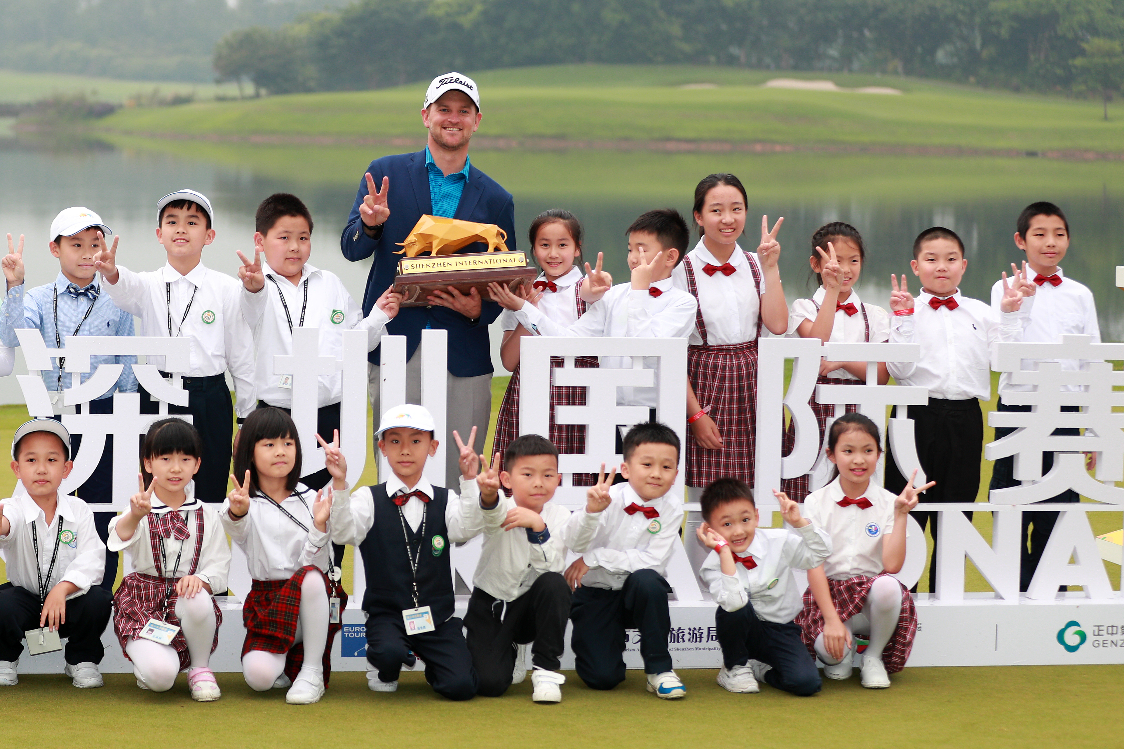 Bernd Wiesberger of Austria celebrates with his trophy after winning the Shenzhen International 