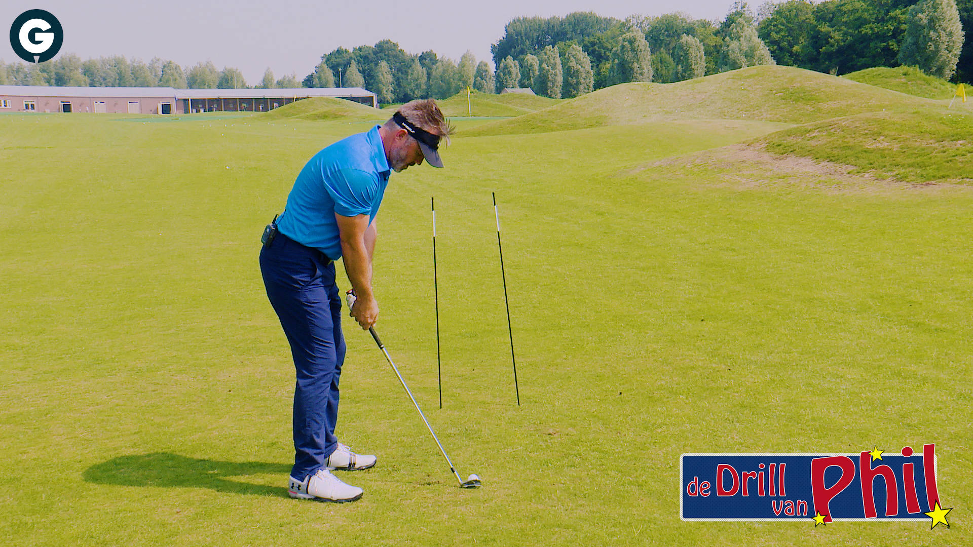 Focus bij de slag naar de green met de drill van Phil